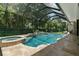Inviting pool and spa with screened enclosure at 638 Limona Woods Dr, Brandon, FL 33510