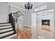 Elegant foyer with chandelier and view to living room at 638 Limona Woods Dr, Brandon, FL 33510