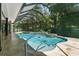 Inviting pool and spa with screened enclosure at 638 Limona Woods Dr, Brandon, FL 33510
