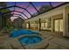 Inviting, freeform pool and spa with a screened enclosure at 638 Limona Woods Dr, Brandon, FL 33510