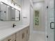 Modern bathroom with frameless shower, quartz countertop, and gold accents at 638 Limona Woods Dr, Brandon, FL 33510