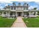 Grand two-story home with covered porch and landscaping at 638 Limona Woods Dr, Brandon, FL 33510