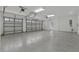 Spacious garage with epoxy flooring and ample storage at 638 Limona Woods Dr, Brandon, FL 33510