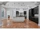 Modern kitchen with two-toned cabinetry, large island, and high-end appliances at 638 Limona Woods Dr, Brandon, FL 33510