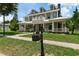 Elegant two-story home with white columns and landscaping at 638 Limona Woods Dr, Brandon, FL 33510