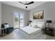 Spacious bedroom with double doors leading to a balcony and en-suite bathroom at 638 Limona Woods Dr, Brandon, FL 33510