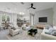 Open-concept living room and kitchen with modern furniture and finishes at 638 Limona Woods Dr, Brandon, FL 33510