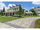 House with a long driveway and manicured lawn at 638 Limona Woods Dr, Brandon, FL 33510