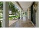 Covered porch with view of the neighborhood at 638 Limona Woods Dr, Brandon, FL 33510