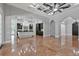 Open concept kitchen with a large island and marble flooring, flows into the living area at 638 Limona Woods Dr, Brandon, FL 33510
