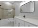 Modern bathroom with white vanity, frameless shower, and updated fixtures at 638 Limona Woods Dr, Brandon, FL 33510