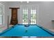 Game room with a pool table and French doors leading to the backyard at 638 Limona Woods Dr, Brandon, FL 33510