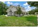 Two-story house with a large front porch and landscaped yard at 638 Limona Woods Dr, Brandon, FL 33510