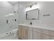 Modern bathroom with marble shower, floating vanity, and gold accents at 638 Limona Woods Dr, Brandon, FL 33510