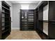 Custom-designed walk-in closet with shelving and drawers at 638 Limona Woods Dr, Brandon, FL 33510