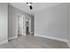 Bright bedroom with wood-look floors and access to closets at 638 Limona Woods Dr, Brandon, FL 33510