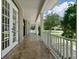 White columns and railing on a spacious front porch at 638 Limona Woods Dr, Brandon, FL 33510