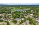 Aerial view showcasing a house's location near a lake and residential area at 638 Limona Woods Dr, Brandon, FL 33510