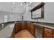 Wet bar with granite countertop, sink, and mini-refrigerator at 638 Limona Woods Dr, Brandon, FL 33510