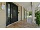Front porch with tiled flooring and double doors at 638 Limona Woods Dr, Brandon, FL 33510