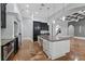 Modern kitchen with two-toned cabinetry, large island, and high-end appliances at 638 Limona Woods Dr, Brandon, FL 33510