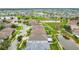 Aerial view showcases a community with waterways and waterfront properties at 6843 Boulder Run Loop, Wesley Chapel, FL 33545