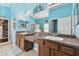 Bright bathroom with blue walls, dual sinks, and a vanity at 6843 Boulder Run Loop, Wesley Chapel, FL 33545