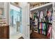 Organized walk-in closet features custom shelving, drawers, and ample space for clothes and accessories at 6843 Boulder Run Loop, Wesley Chapel, FL 33545
