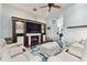 Relaxing living room with a built-in media center, plush seating, and dark hardwood floors at 6843 Boulder Run Loop, Wesley Chapel, FL 33545