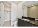 Modern bathroom with dark vanity and walk-in shower at 2910 W Barcelona St # 802, Tampa, FL 33629