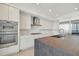 Modern kitchen with stainless steel appliances and a large island at 2910 W Barcelona St # 802, Tampa, FL 33629