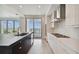 Modern kitchen with water views and a large island at 2910 W Barcelona St # 802, Tampa, FL 33629