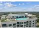 Aerial view of building with rooftop pool and amenities at 2910 W Barcelona St # 802, Tampa, FL 33629
