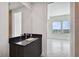 Clean bathroom with dark vanity and view of bedroom at 2910 W Barcelona St # 802, Tampa, FL 33629