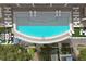 Aerial view of a rooftop pool with surrounding lounge chairs at 2910 W Barcelona St # 802, Tampa, FL 33629