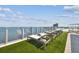 Relaxing rooftop lounge area with artificial turf and water views at 2910 W Barcelona St # 802, Tampa, FL 33629
