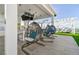 Covered rooftop terrace with hanging chairs and a bar area at 2910 W Barcelona St # 802, Tampa, FL 33629
