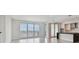 Open living room with water view and kitchen access at 2910 W Barcelona St # 802, Tampa, FL 33629