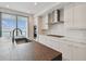 Modern kitchen with water views and a large island at 2910 W Barcelona St # 802, Tampa, FL 33629