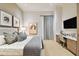 Spacious bedroom with a large bed, desk, and city views at 2910 W Barcelona St # 802, Tampa, FL 33629