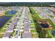 Aerial view of a residential area featuring houses and ponds at 13336 Great Plains Dr, Riverview, FL 33579