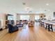 Open concept living room and kitchen with hardwood floors at 13336 Great Plains Dr, Riverview, FL 33579