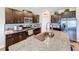 Modern kitchen with granite countertops, stainless steel appliances, and an island at 13336 Great Plains Dr, Riverview, FL 33579