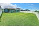 Large backyard with grassy lawn and privacy fence at 13336 Great Plains Dr, Riverview, FL 33579