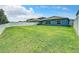 Large backyard with grassy lawn and privacy fence at 13336 Great Plains Dr, Riverview, FL 33579