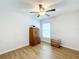 Bedroom with ceiling fan, wood-look floors, and large closet at 13336 Great Plains Dr, Riverview, FL 33579