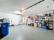 Spacious garage with overhead storage and attic access at 13336 Great Plains Dr, Riverview, FL 33579
