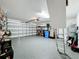 Organized garage with storage shelving and epoxy flooring at 13336 Great Plains Dr, Riverview, FL 33579