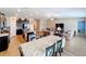 Open concept kitchen and dining area with stainless steel appliances and hardwood floors at 13336 Great Plains Dr, Riverview, FL 33579
