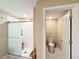 Walk-in shower with bench and adjacent toilet at 13336 Great Plains Dr, Riverview, FL 33579